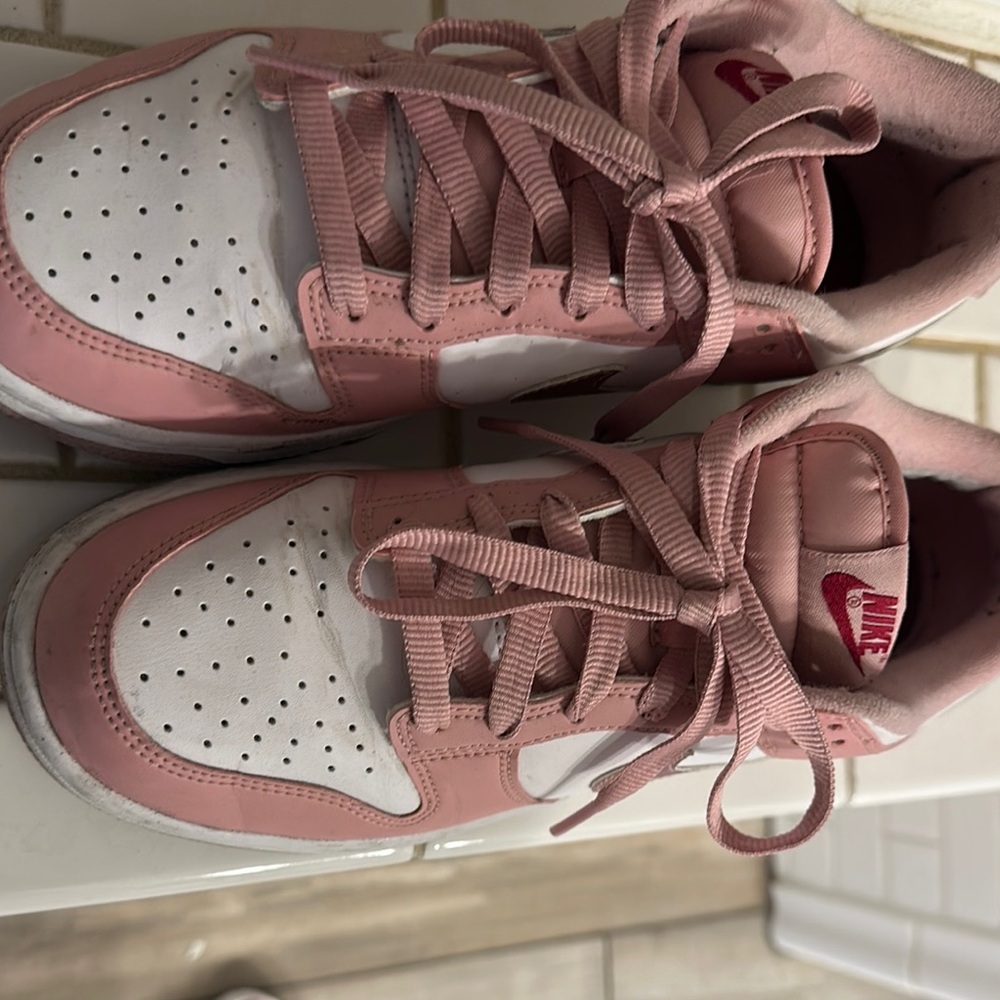 Nike Pink and White Sneakers with Classic Design